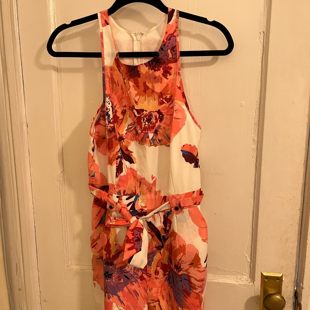Women’s pink floral polyester romper, size M. Attached belt to tie in front